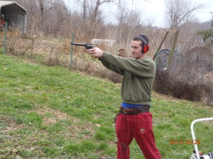 Pat target shooting with Dad, Deceber 20, 2013. They had a .22 handgun contest which Dad won and then a shoot off with the Beretta 92FS that Pat won very handily.